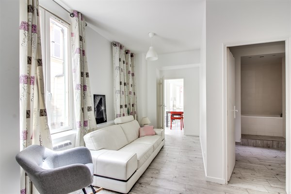 Living room with hardwood floors and sofa