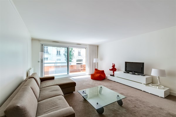 Living room with fold-out sofa and flat screen TV